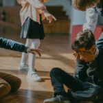 Group of kids bullying another child at school, signaling peer pressure and harassment.