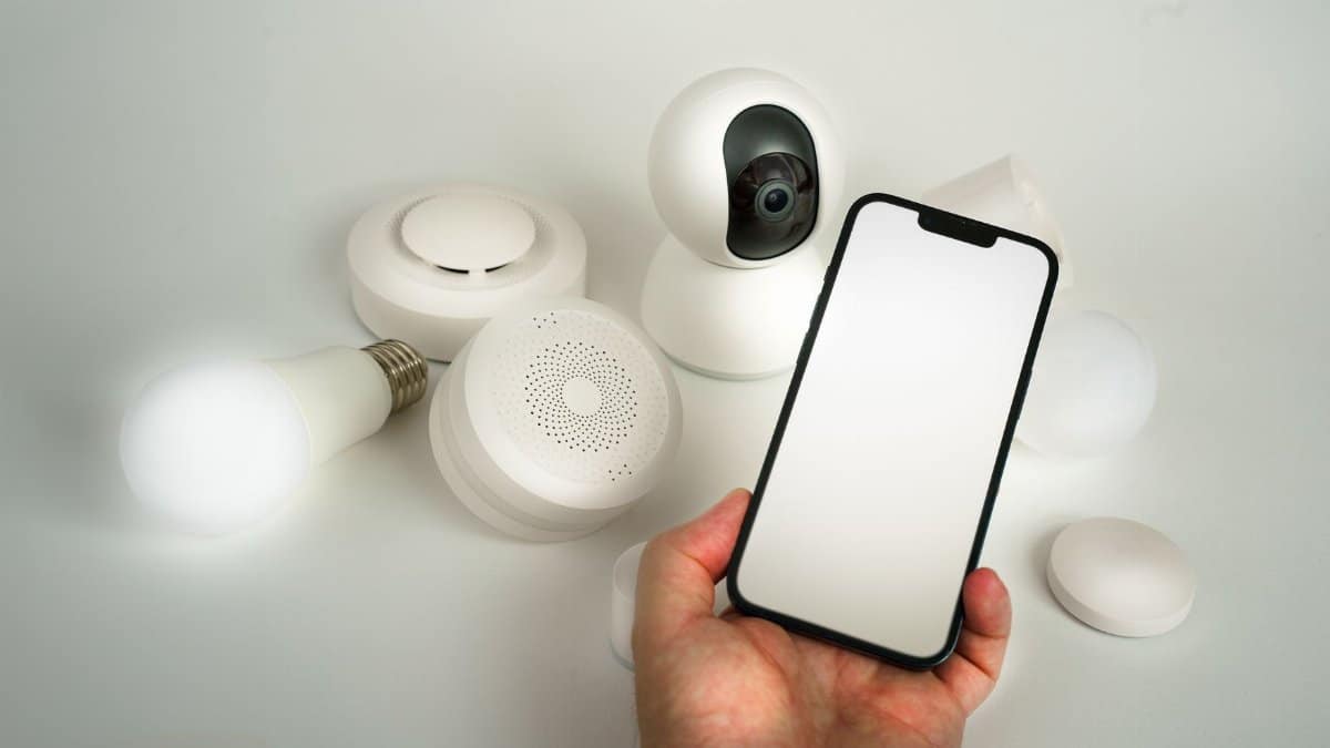 Showcase of various smart home devices controlled via a smartphone, highlighting automation and security.
