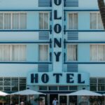 Colony Hotel in Miami Beach, iconic Art Deco architecture with classic cars.