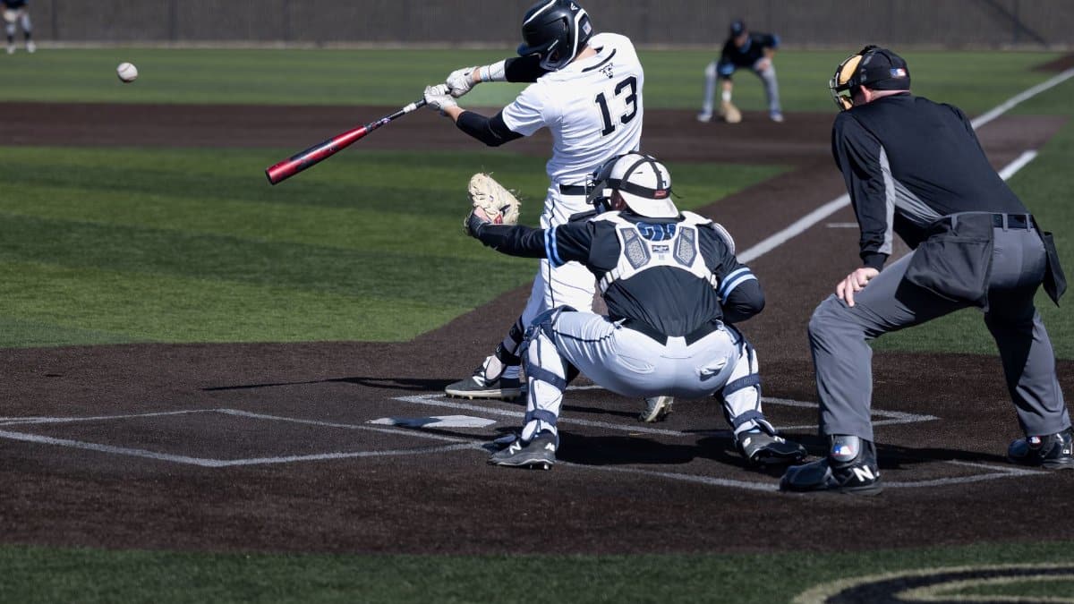 A thrilling moment captured during a baseball game in Colorado Springs, showcasing dynamic sports action.