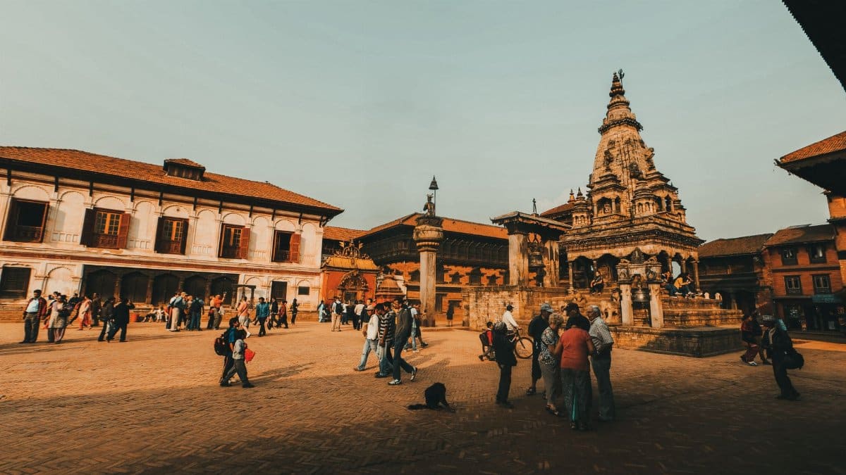 Discover the lively atmosphere at this historic temple courtyard, capturing the essence of cultural tourism and architecture.