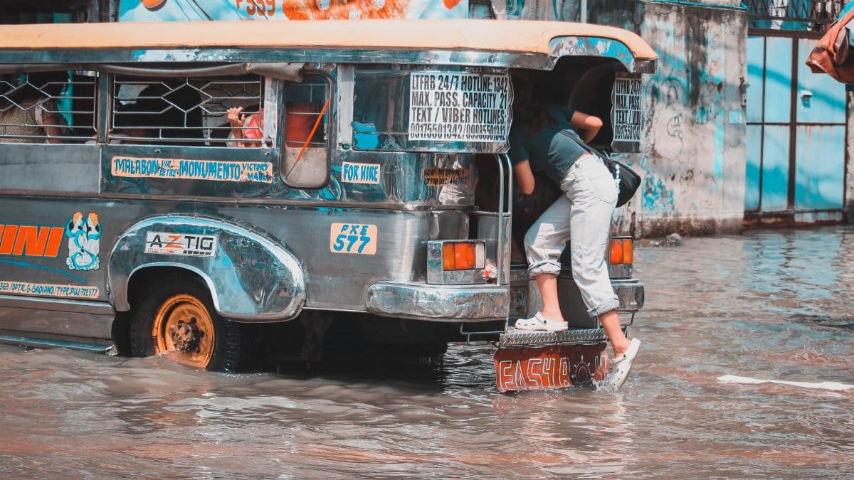 Jeepney navigating through a flooded street in Malabon, Metro Manila.