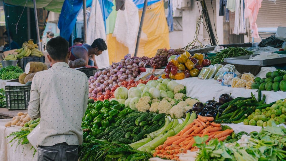 Explore a bustling market scene filled with diverse fresh vegetables and vibrant energy.