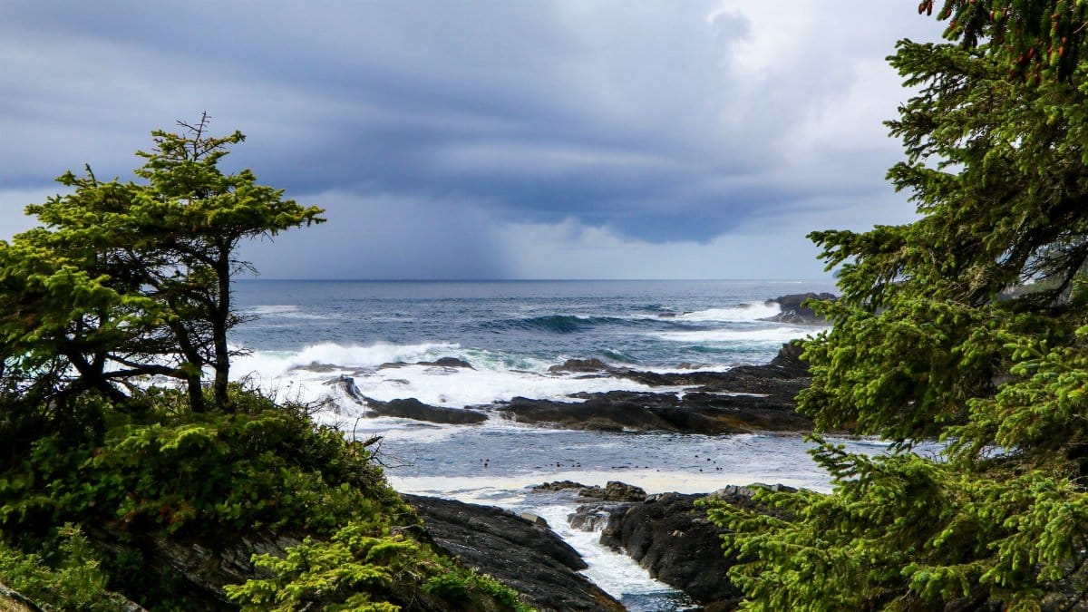 Dramatic ocean view with storm clouds over the rocky coast of British Columbia.
