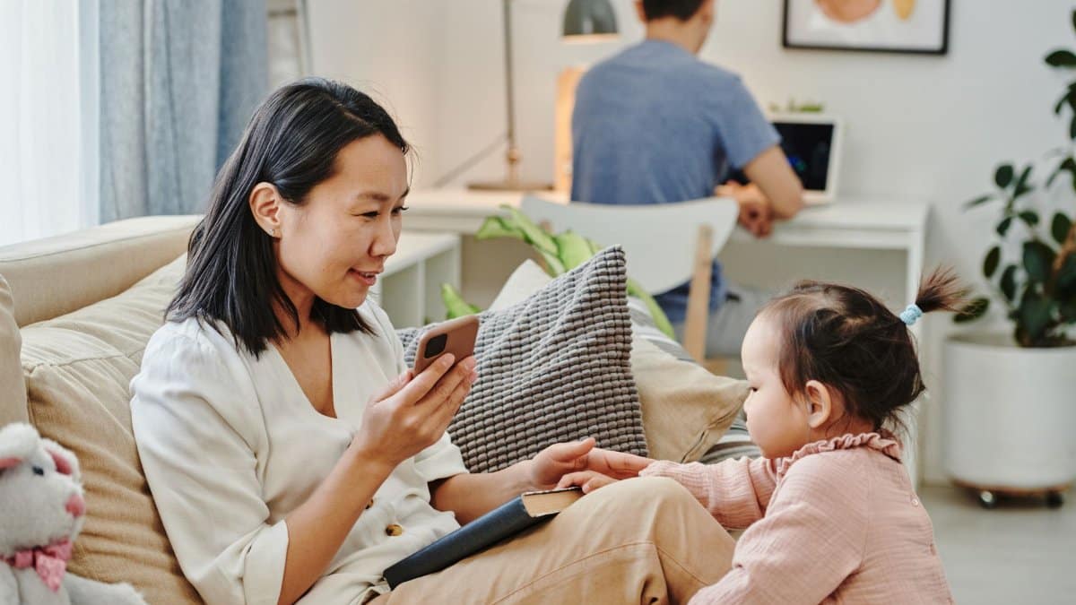 Asian family spending time together, balancing work and play at home.