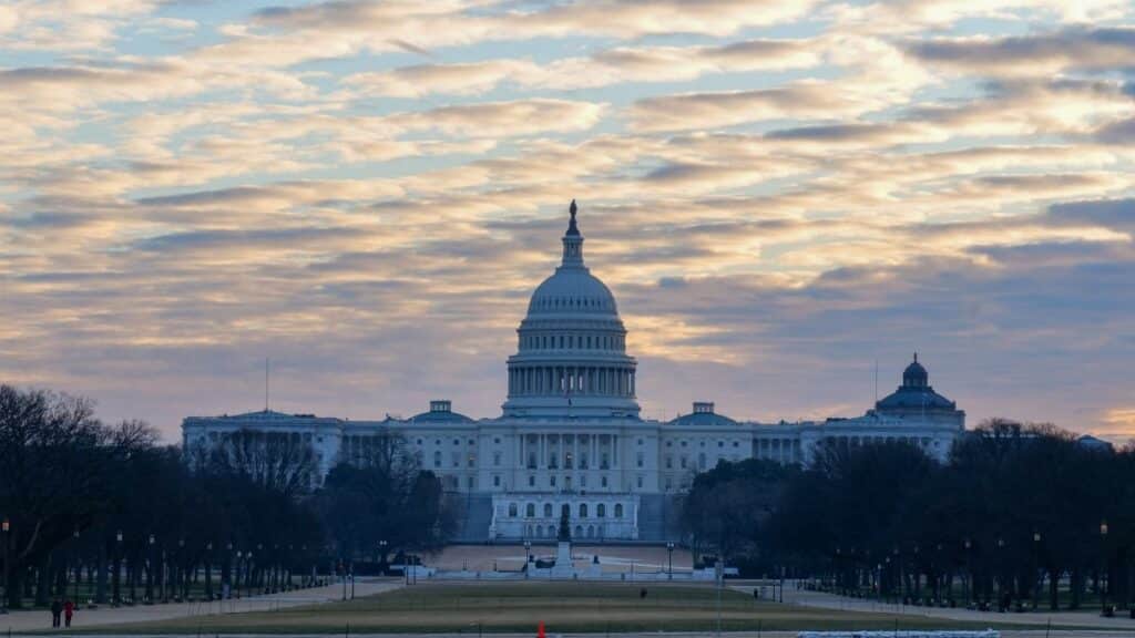 Stunning view of the U.S. Capitol Building during sunrise in Washington DC, highlighting its iconic architecture.