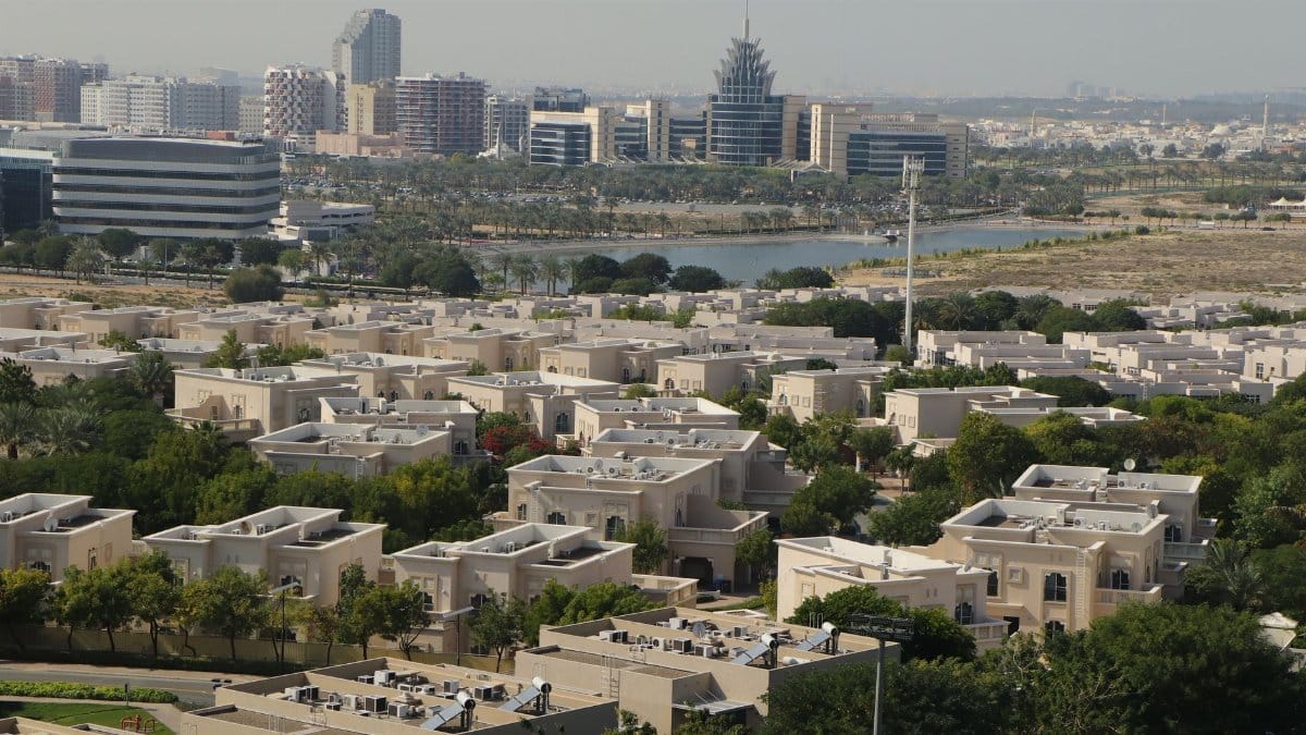 Panoramic cityscape of Dubai's residential district with modern skyline in the background.