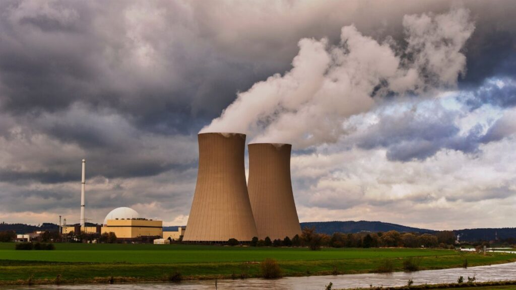 Scenic view of a nuclear power plant with cooling towers emitting steam in Hameln, Germany.