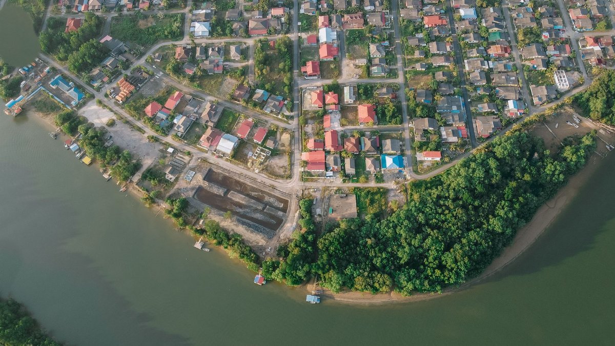 Aerial view of Chukai, Terengganu, Malaysia showing houses, roads, and river