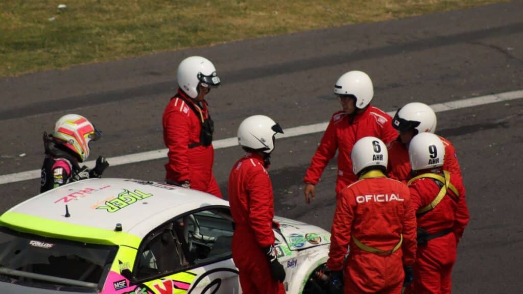 Race crew with driver after a race event in Ciudad de México, Mexico.