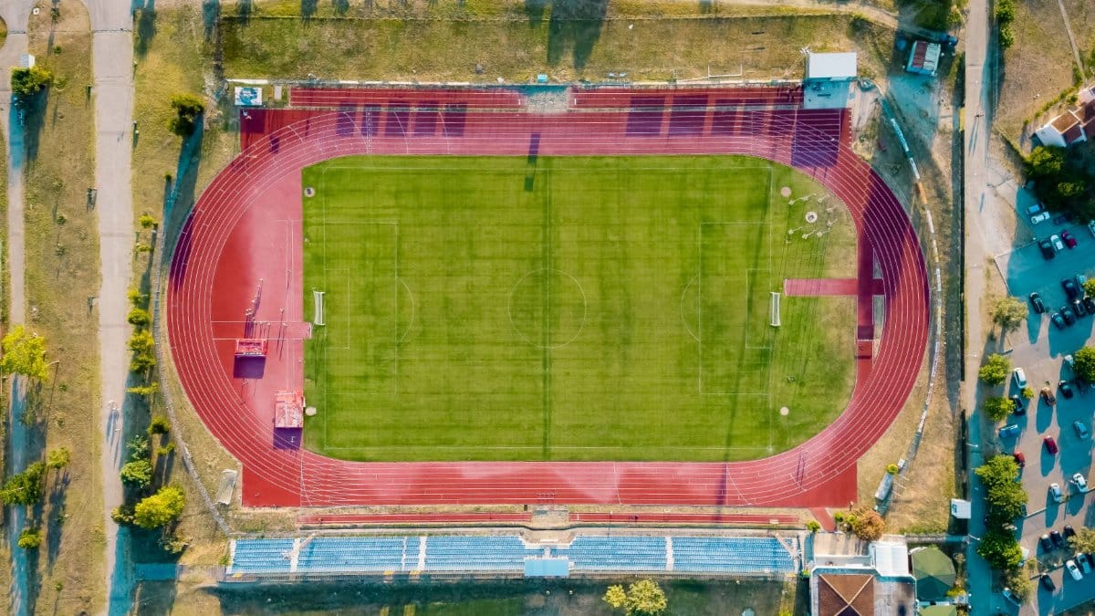 An aerial view of a sports field with a track in Bar, Montenegro.