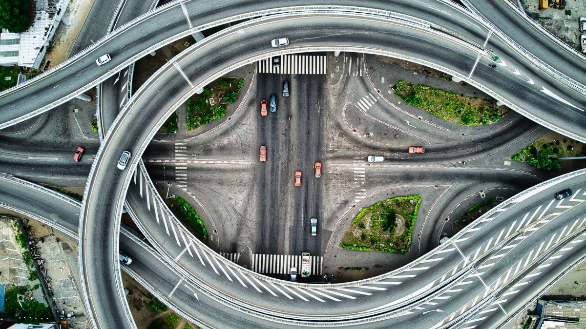 Aerial view of a modern highway interchange in Abidjan, showcasing intricate road design.
