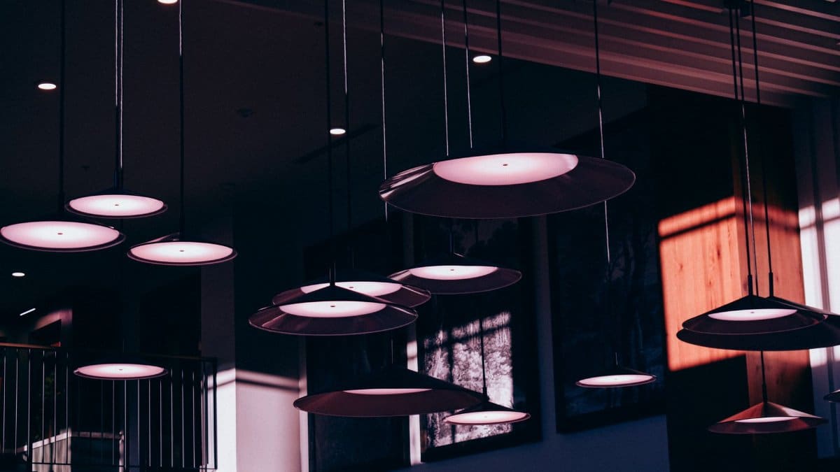 A contemporary café interior with artistic lighting design and moody ambiance.