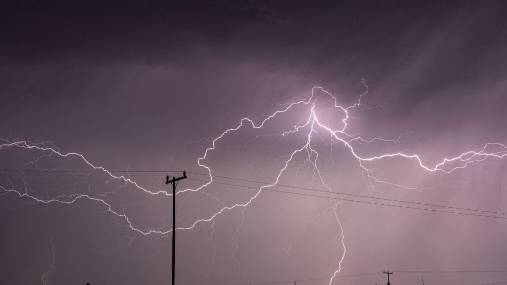 Captivating long exposure shot of a lightning storm over power lines in KwaZulu-Natal, South Africa.
