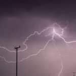 Captivating long exposure shot of a lightning storm over power lines in KwaZulu-Natal, South Africa.