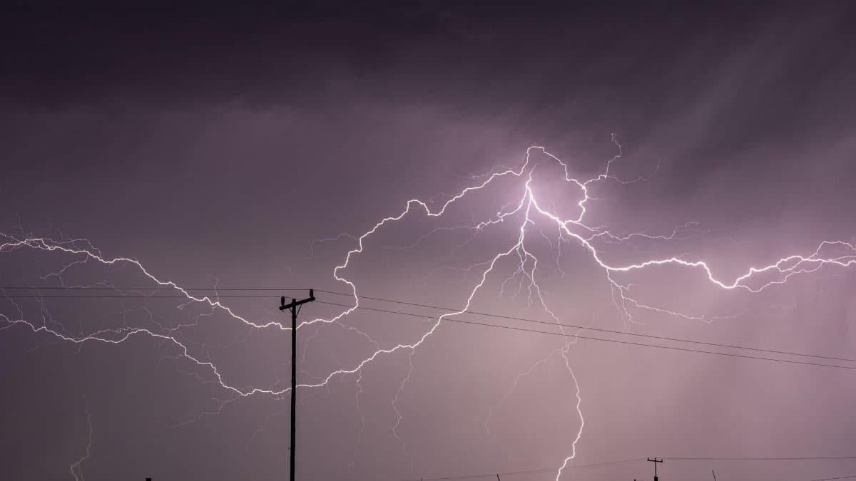 Captivating long exposure shot of a lightning storm over power lines in KwaZulu-Natal, South Africa.