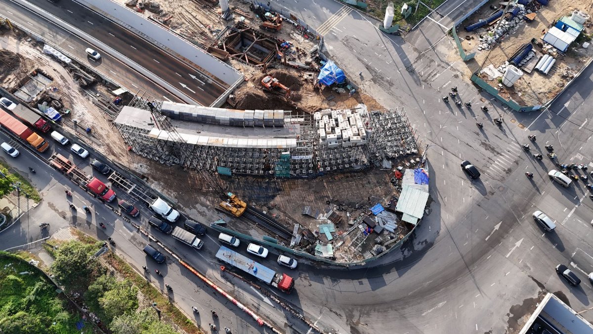 An aerial shot of a busy construction site and traffic in Ho Chi Minh City, Vietnam.