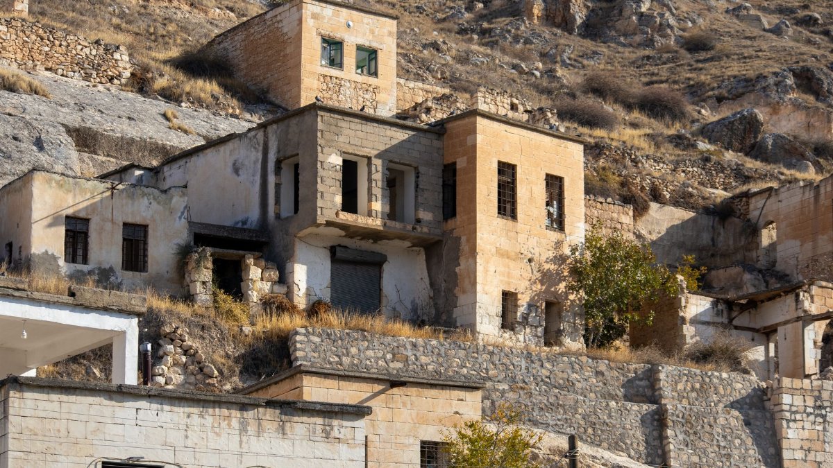 Rustic stone houses blend into the rocky terrain of Halfeti, Turkey.