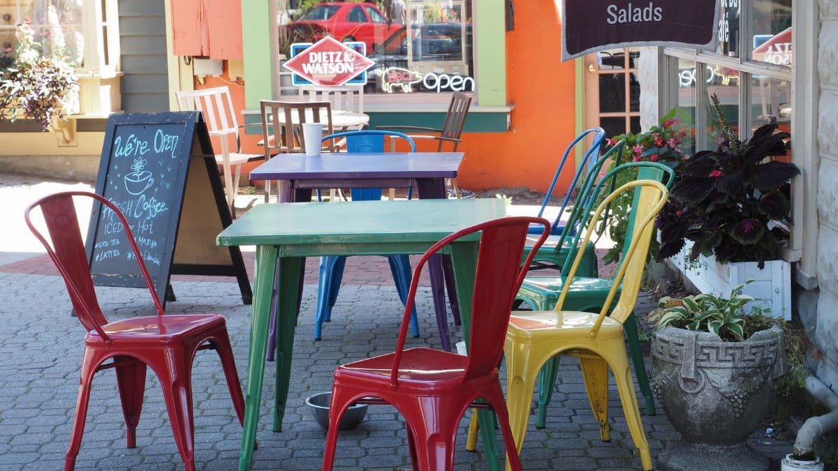 Vibrant chairs and tables at an outdoor cafe in Frenchtown, NJ, creating a lively and inviting atmosphere.
