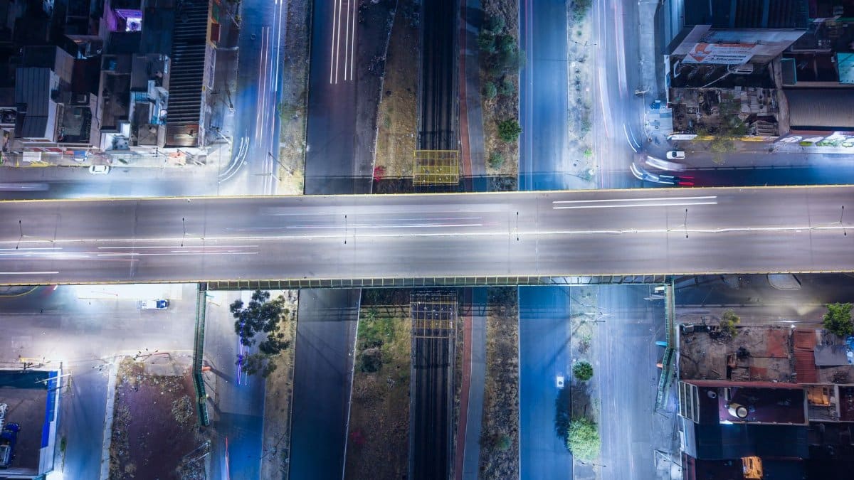 Stunning aerial night view of a highway intersection in Ecatepec, Mexico, showcasing urban infrastructure.