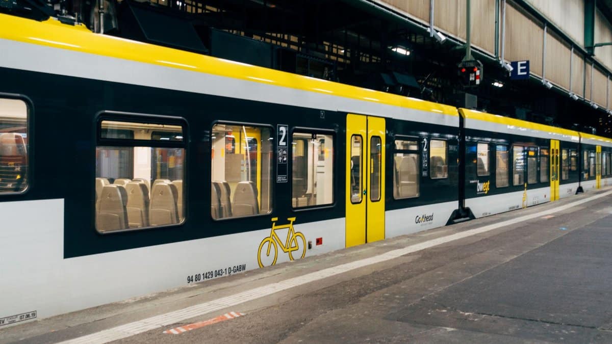 A view of a modern yellow and black train at Stuttgart's station platform, Germany.