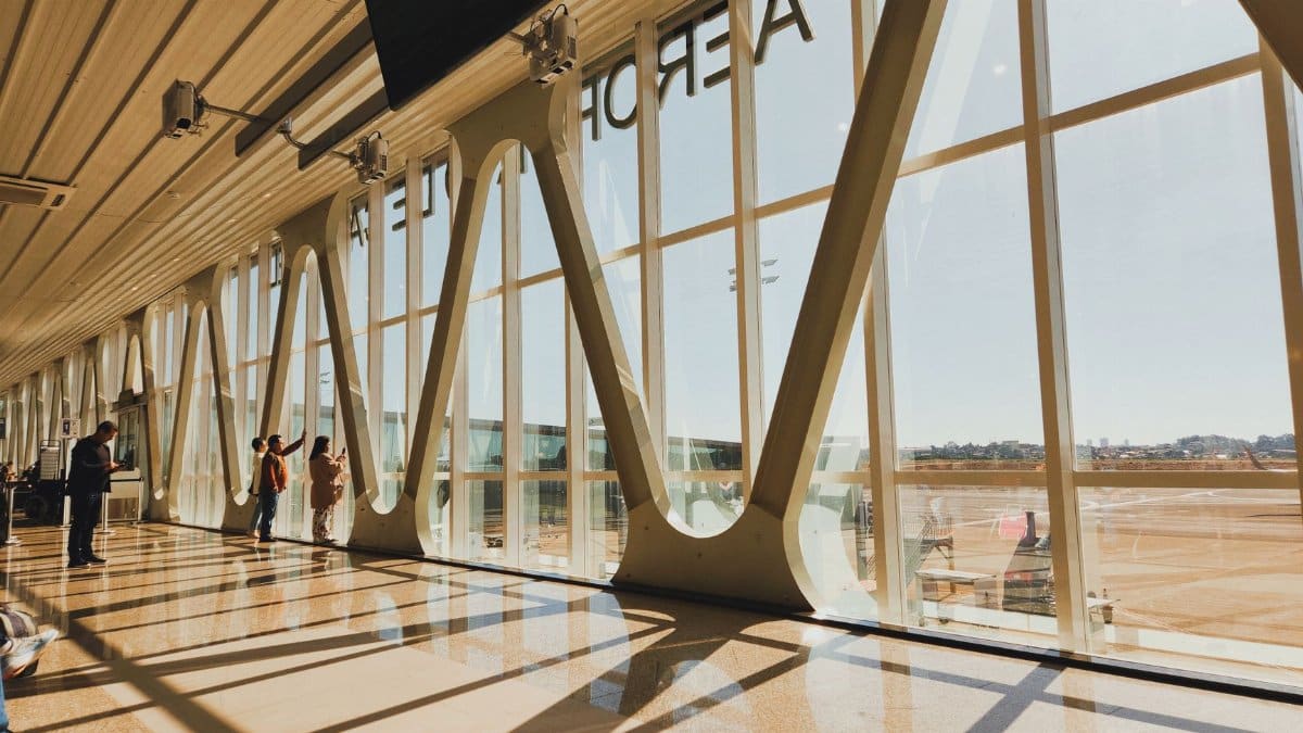 Interior view of a sunlit airport terminal in Cascavel, Brazil, showcasing modern architecture.
