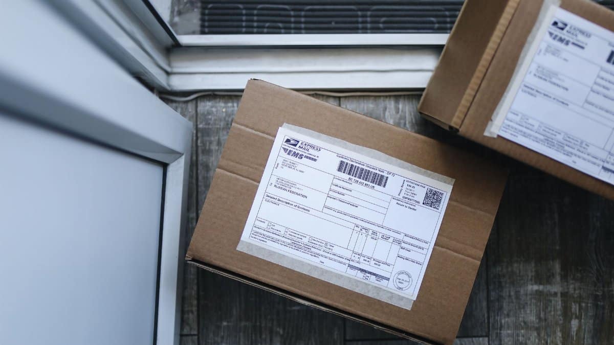 Close-up of a package delivery box on a doorstep, highlighting logistics concepts.