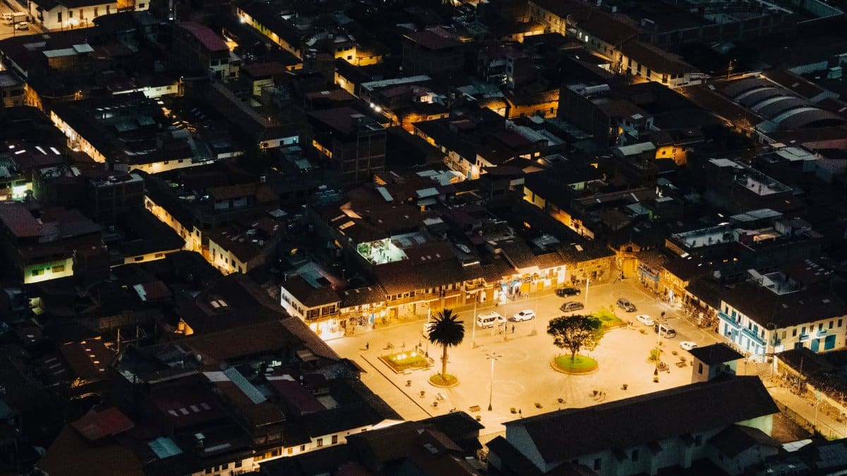 Stunning aerial view of illuminated Písac city square at night in Cuzco, Peru.