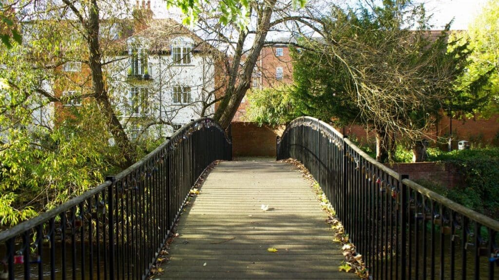 Scenic view of a footbridge in a park in Salisbury, England during autumn.