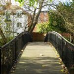 Scenic view of a footbridge in a park in Salisbury, England during autumn.