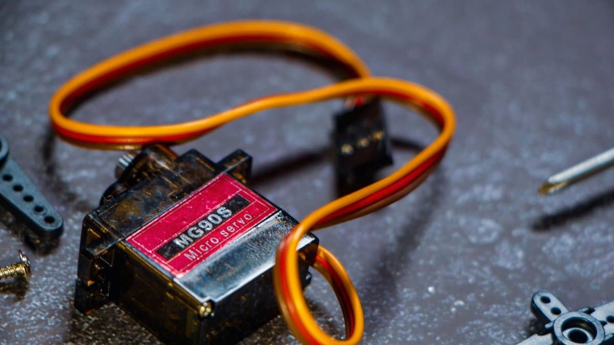 Detailed view of MG90S micro servo motor, perfect for robotics projects.