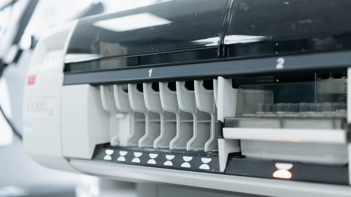 A close-up of advanced laboratory testing equipment used for medical and scientific research in a sterile environment.