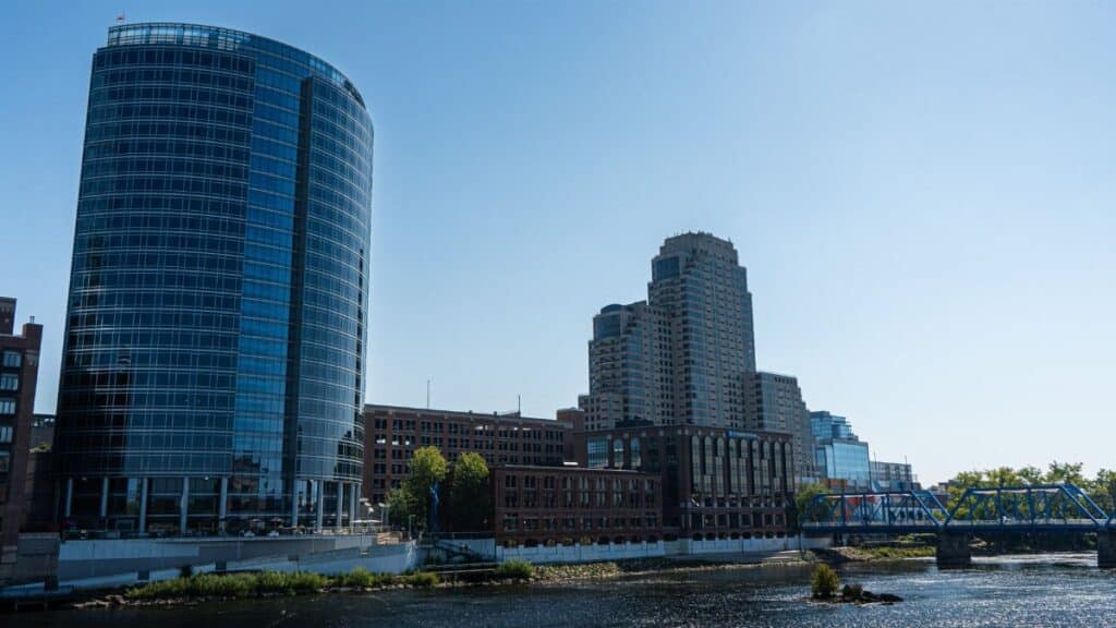 Scenic view of Grand Rapids skyline featuring the iconic Blue Bridge and modern architecture by the Grand River in Michigan.