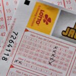 Detailed close-up of a EuroJackpot lottery ticket with selected numbers in focus.