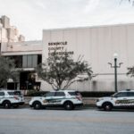 Sheriff vehicles parked in front of Seminole County Courthouse during the day.