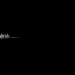 A satellite orbiting Earth amidst the vastness of space, capturing the planet's beauty.