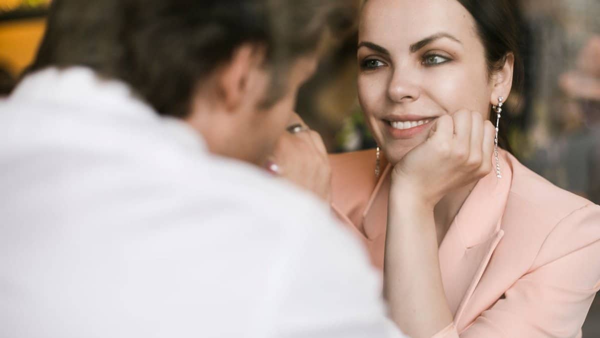 A couple sharing a heartfelt moment indoors, showcasing love and connection.