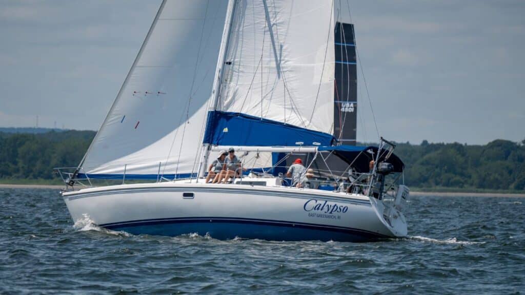 Sailboat Calypso sailing in East Greenwich, Rhode Island, captured on a sunny day on Narragansett Bay.