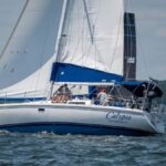 Sailboat Calypso sailing in East Greenwich, Rhode Island, captured on a sunny day on Narragansett Bay.