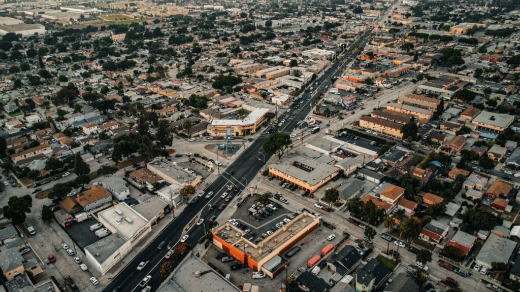 Aerial view of urban residential area in Los Angeles, showcasing streets, buildings, and city layout.
