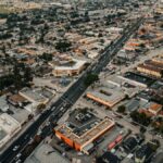 Aerial view of urban residential area in Los Angeles, showcasing streets, buildings, and city layout.