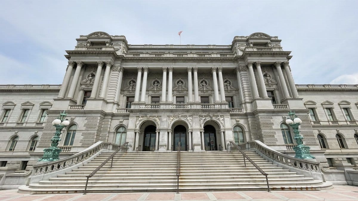 Front view of the neoclassical Library of Congress building in Washington, DC, showcasing grand architecture.