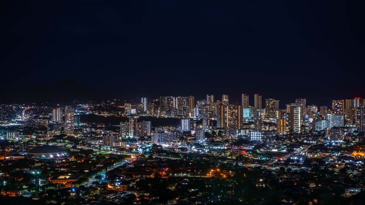 Vibrant nighttime cityscape showcasing the illuminated skyline of a bustling metropolis.