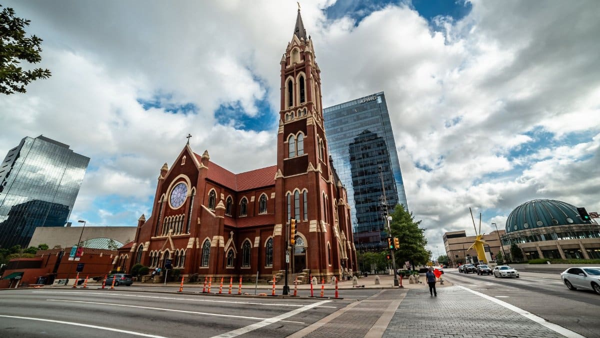 Stunning view of a historic church amid modern Dallas skyline, Texas.
