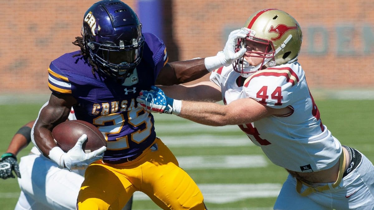 Dynamic moment captured during an American football match showcasing competition and teamwork.