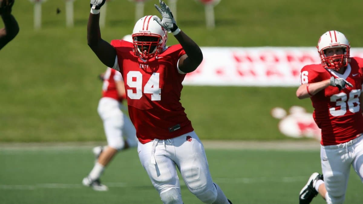 Athletes in action during an energetic American football game.