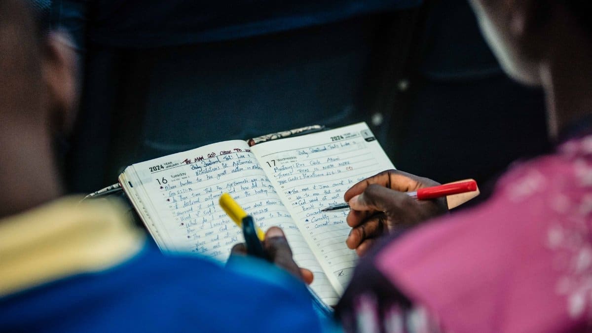People engaging in a focused Bible study session, sharing notes and insights.