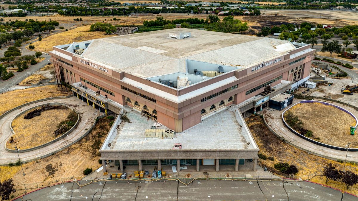 Aerial shot of the iconic Sleep Train Arena in Sacramento during daylight.