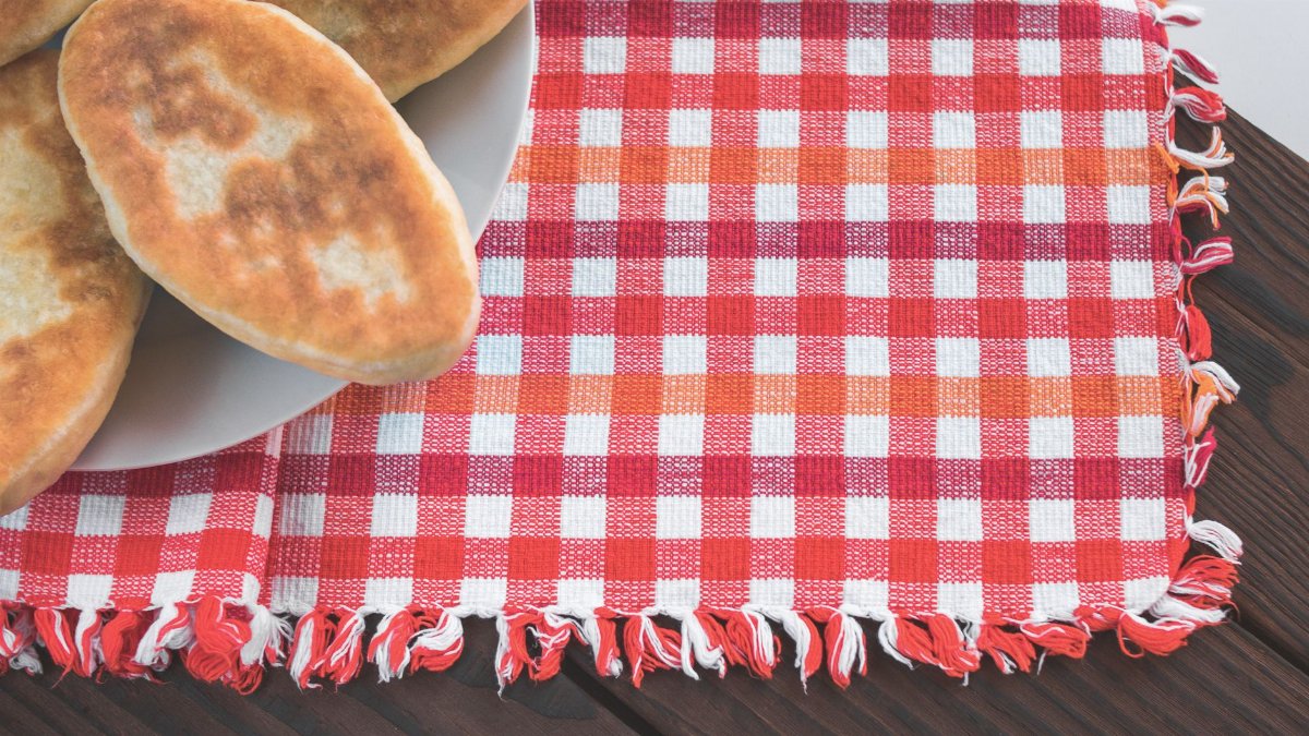 Delicious homemade pastries on a vibrant checkered cloth perfect for bakery promotions.