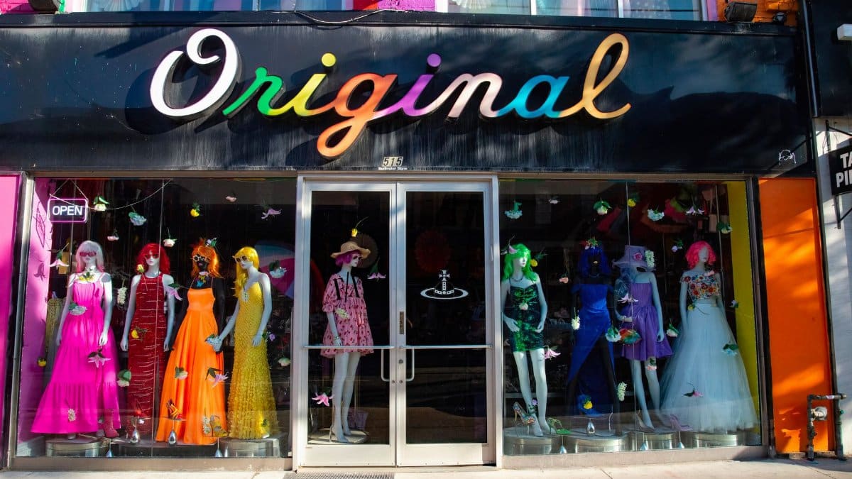 Vibrant mannequin display showcasing eclectic fashion in a Toronto boutique window.